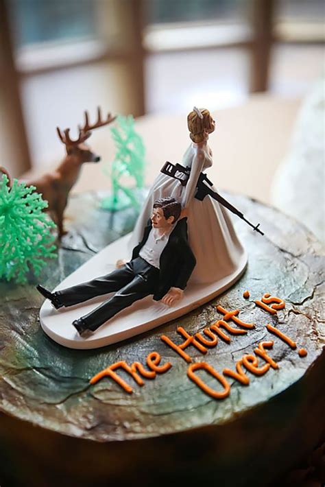 There Is A Wedding Cake With A Bride And Groom On The Surfboard In The