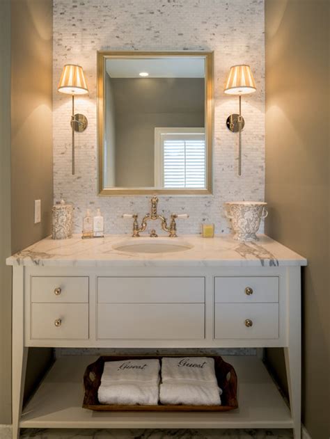 Grab some inspiration from this modern powder room that sports dark wall paint combined with charming framed mirror with crown! Elegant Powder Room | Houzz