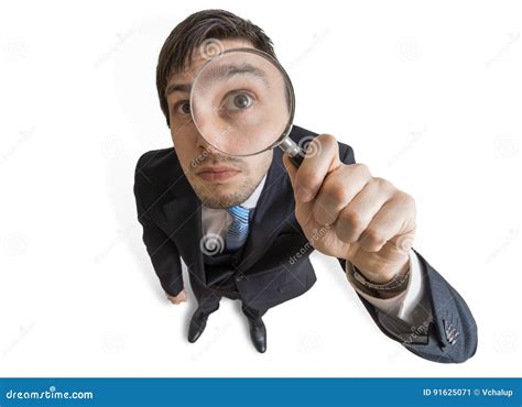Young Man Is Looking Through Magnifying Glass Isolated On White