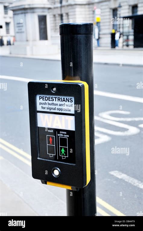 Push Button At A Pedestrian Road Crossing With Traffic Lights Stock