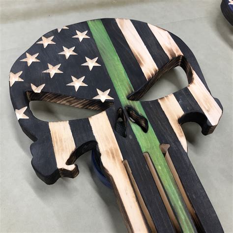 The punisher is a thin character on his own merits, but that allows for a lot of interpretations and a variation of the punisher's skull emblem that was used by protesters at the 2017 unite the right after killing the sinister six and the green goblin, he ultimately retires the punisher persona to avoid. Wooden American Flag Punisher Skull Thin Blue Line (Red ...
