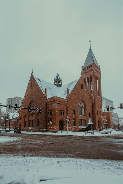 A Large Red Brick Building With A Clock Tower Photo Free Denver Image