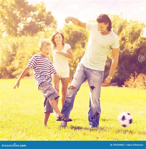 Parents With Child Playing With Soccer Ball Stock Photo Image Of