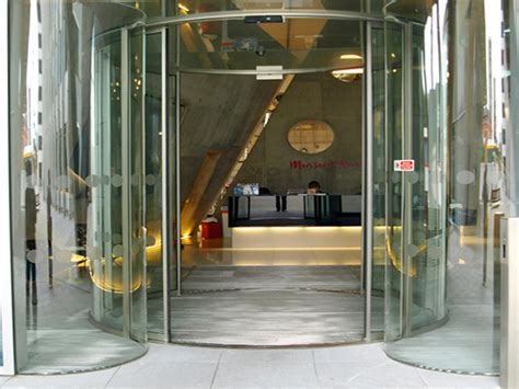 Tall Oversized Circular Sliding Glass Doors Over Meters In Height By Open Entrances London UK