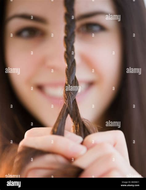Young Woman Braiding Her Hair Stock Photo Alamy