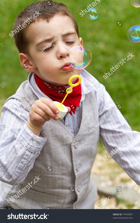 Boy Blowing Bubbles Park Stock Photo 77493907 Shutterstock