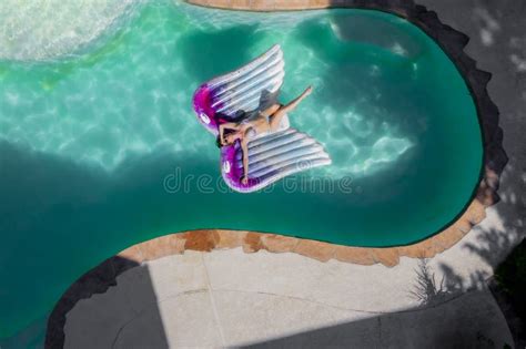 a lovely brunette swimsuit model enjoys her holiday at the pool stock image image of chlorine