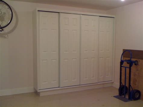 Using bypass sliding doors garage cabinets allows access to the cabinets while the cars are parked in the garage. sliding door garage storage | Garage storage cabinets ...
