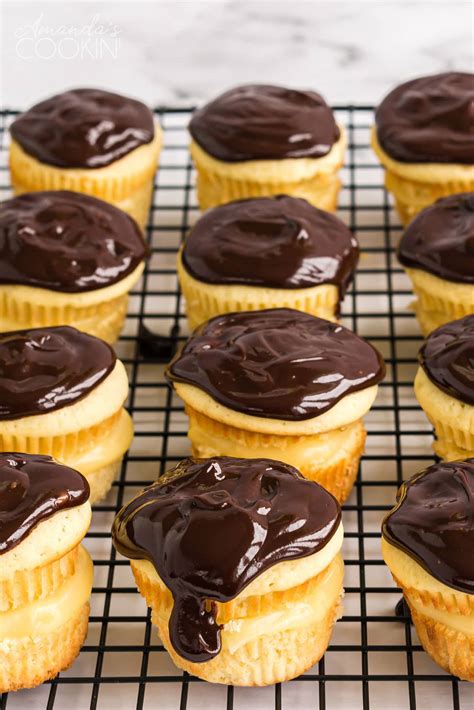 Once the cake is fully cooled, poke holes throughout it using the opposite end of a wooden spoon (see photo for reference). Boston Cream Cupcakes - Amanda's Cookin' - Cake & Cupcakes