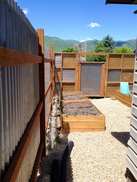 Corrugated metal fencing can be used in a variety of ways, ranging from adding a different touch to your garden border to enclosing your yard in style. corrugated metal fence diy