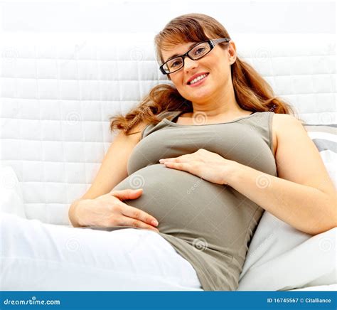 Pregnant Woman Lying On Sofa And Holding Belly Stock Image Image Of