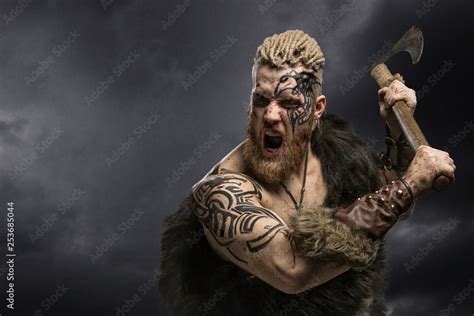 Medieval Warrior Berserk Viking With Tattoo And In Skin With Axe
