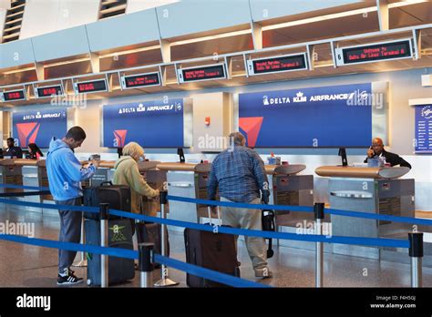 air passengers at the baggage drop check in terminal a logan international airport boston