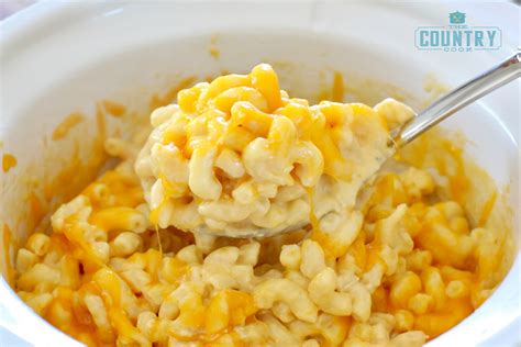 Sharp cheddar and parmesan cheese combine for this extra creamy mac 'n' cheese recipe. Slow Cooker Macaroni and Cheese - The Country Cook slow cooker