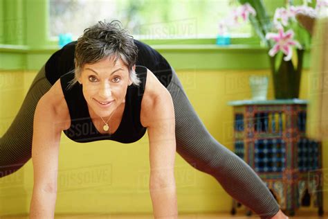 Older Caucasian Woman Practicing Yoga Stock Photo Dissolve