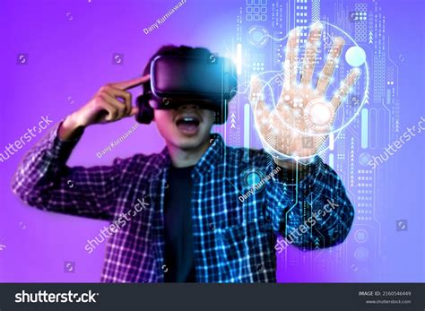 Young Man Having Virtual Reality Experience Stock Photo 2160546449