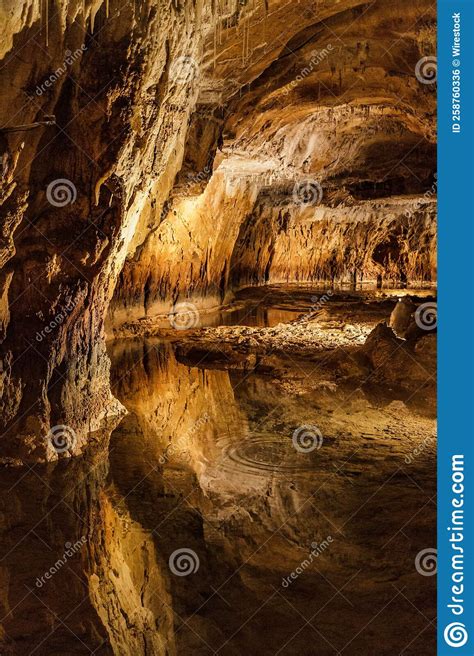 Vertical Shot Of The Inside Of A Cave With Stalagmites And Stalactites