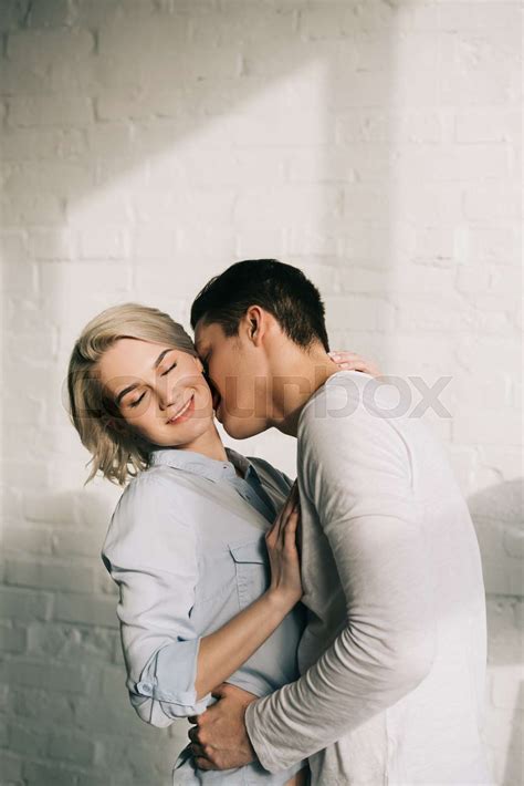 Boyfriend Kissing Girlfriends Neck At Home Stock Image Colourbox
