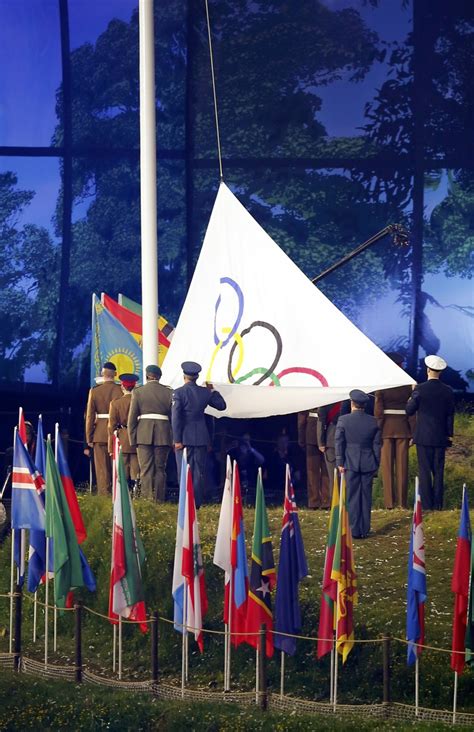 Naomi osaka of japan holds the olympic torch after lighting the olympic cauldron at the opening ceremony. Highlight of London Olympics Opening Ceremony in Pictures ...