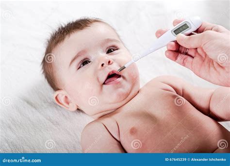 Doctor Measures The Temperature Of Little Baby Stock Image Image Of