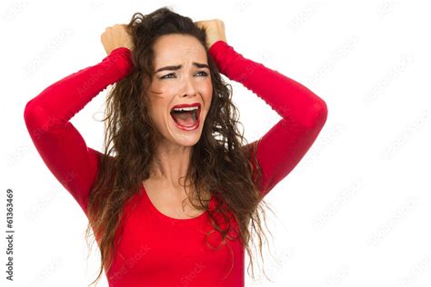 Angry and upset woman screaming and crying Isolated on white ภาพถาย