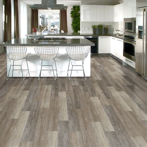 Manufactured by shaw, it boasts all of laminate flooring's benefits and more. TrafficMASTER Brushed Oak Taupe 6 in. x 36 in. Luxury ...