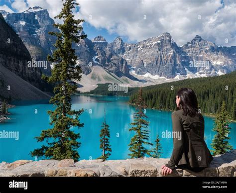 Female Tourist Looking At The View At Moraine Lake In Banff National