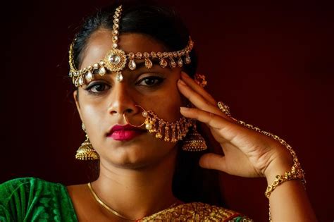 Premium Photo Portrait Indian Beautiful Female In Golden Rich Jewelery And Tradition Saree