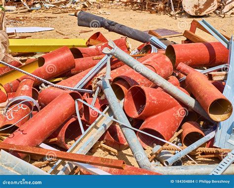Pipes And Other Construction Debris At Construction Waste Dump Stock