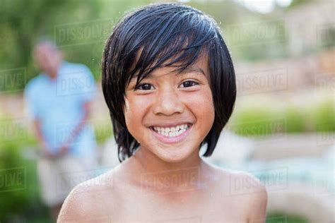 Boy Smiling Outdoors Stock Photo Dissolve