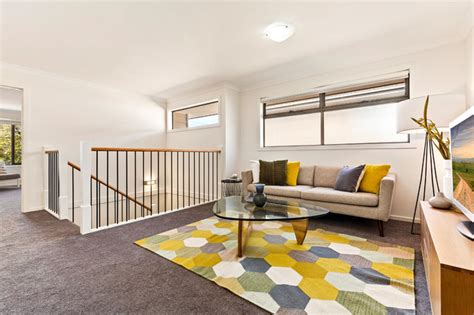 The meridian's expansive interior encompasses two master suites, one on each level, and three separate living areas: Metricon Bentleigh - Living Room - Melbourne | Houzz AU