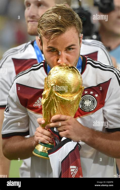 rio de janeiro brazil 13th july 2014 mario goetze of germany kisses the world cup trophy