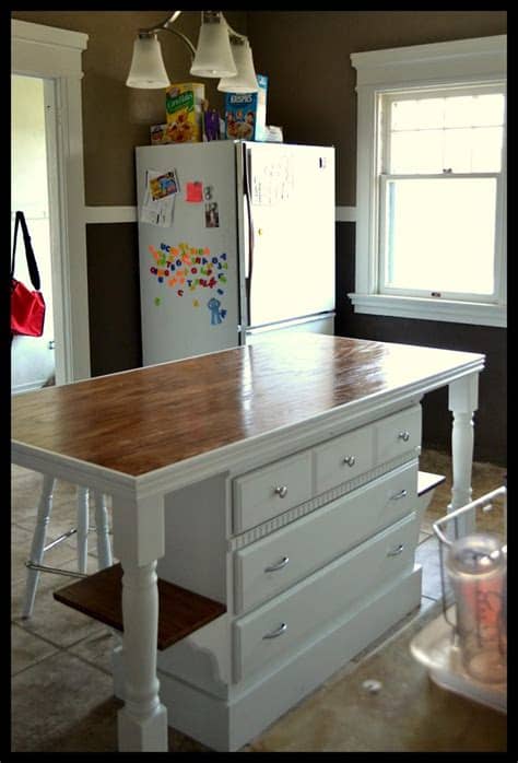 The natural hickory laminated used in the base cabinets combined with the beige. 51 Awesome Small Kitchen With Island Designs - Page 5 of 10