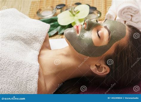 Face Peeling Mask Spa Beauty Treatment Skincare Woman Getting Facial Care By Beautician At