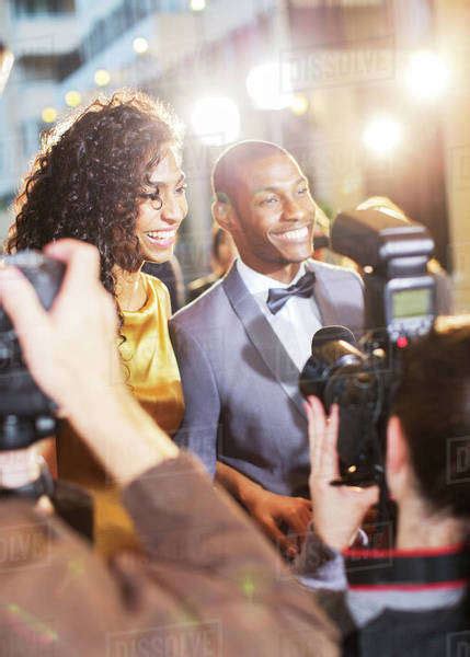 Celebrity Couple Being Interviewed And Photographed By Paparazzi At