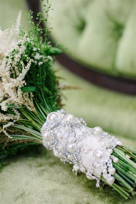Fill clear vases with vase fillers that fit your wedding theme! Bridal Bouquet Handle done with a jewel ribbon wrap ...