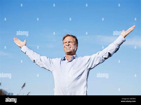 Mature Man Spreading His Arms With Joy Stock Photo Alamy