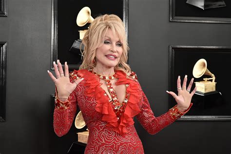 dolly parton rocks on new single world on fire spin
