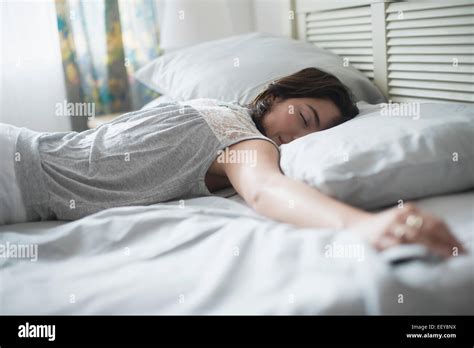 Woman Sleeping In Bed Stock Photo Alamy