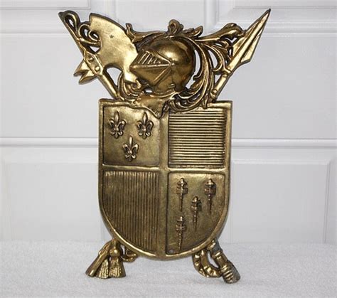 vintage large cast metal brass coat of arms by queenieseclectic