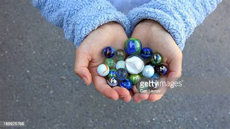 Hand Holding Marble Photos And Premium High Res Pictures Getty Images