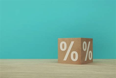 Percentage Sign Symbol Icon With Paper Cube Block On Wooden Table And