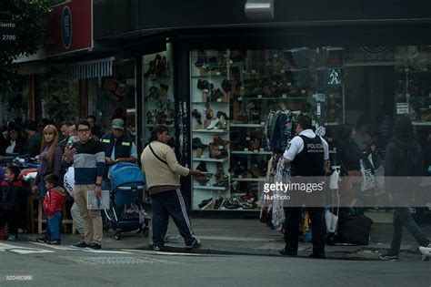 A Policeman Walks While Carrying Out Illegal Sales In Once Buenos