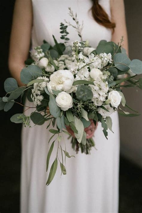 Loose And Beautiful White Bridal Bouquet With Ranunculus Stock And