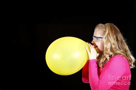 Girl Inflating Balloon Photograph By Ted Kinsman