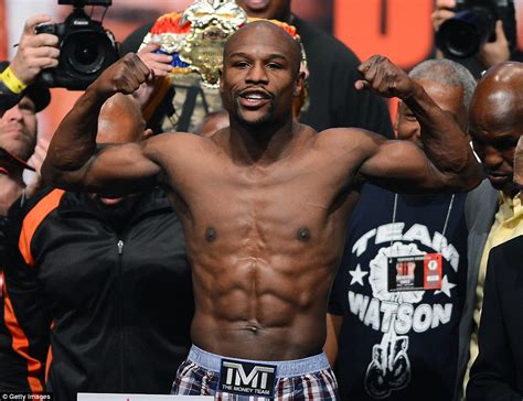 Floyd Mayweather Poses In Front Of His Incredible Collection Of Sports