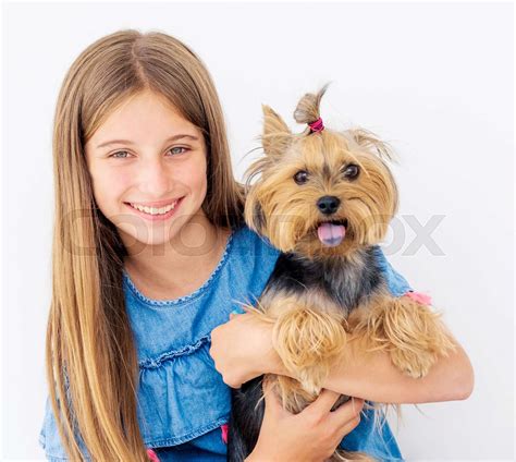 Portrait Of Girl Holding Dog Stock Image Colourbox