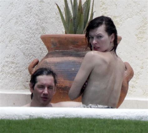 Milla Jovovich Topless But Hiding Her Boobs In Cabo San Lucas Porn