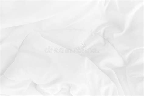 Close Up Top View Of White Bedding Sheet And Wrinkle Messy Blanket In