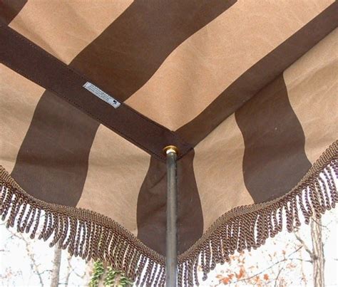 An Umbrella With Brown And White Stripes On It